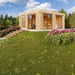 Set on a small hill with garden steps, the GardenHouse24 USA Sauna Dolce 70 Garden Room blends modern wood styling with nature-friendly landscaping