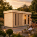 Sauna Giusto 70 illuminated by golden-hour sunlight as three adults enjoy a relaxing gathering in a luxury landscaped backyard.