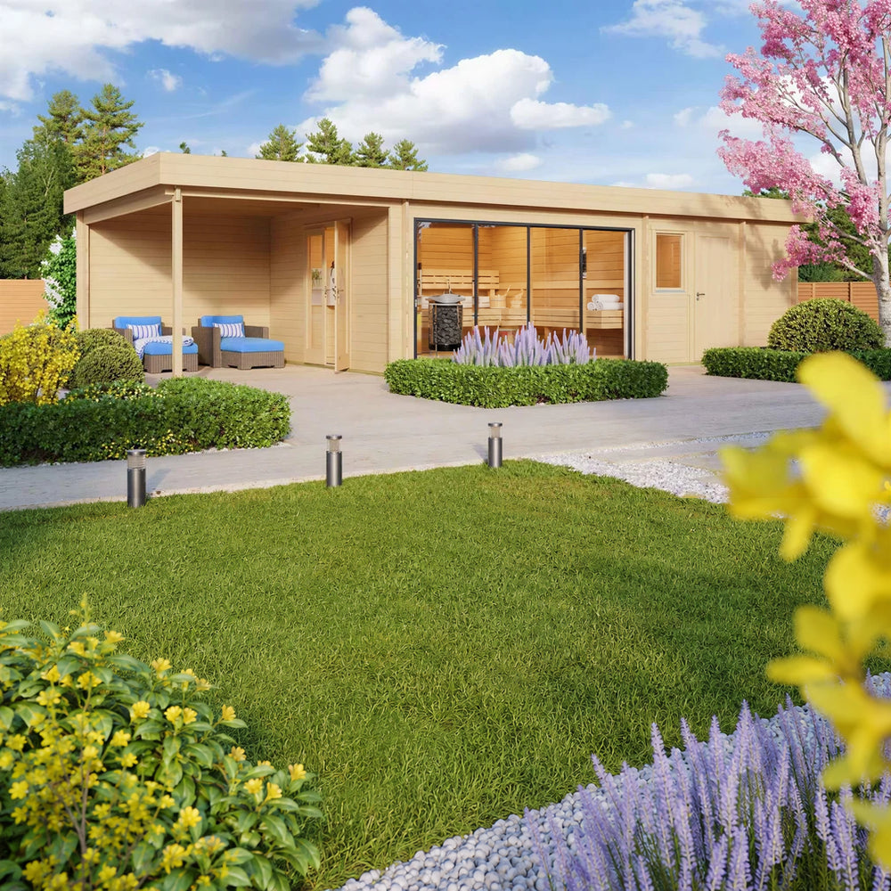 A vibrant spring setting frames the GardenHouse24 USA Sauna St.Moritz 70 Garden Room, with blooming trees, outdoor seating, and a glass-fronted lounge interior