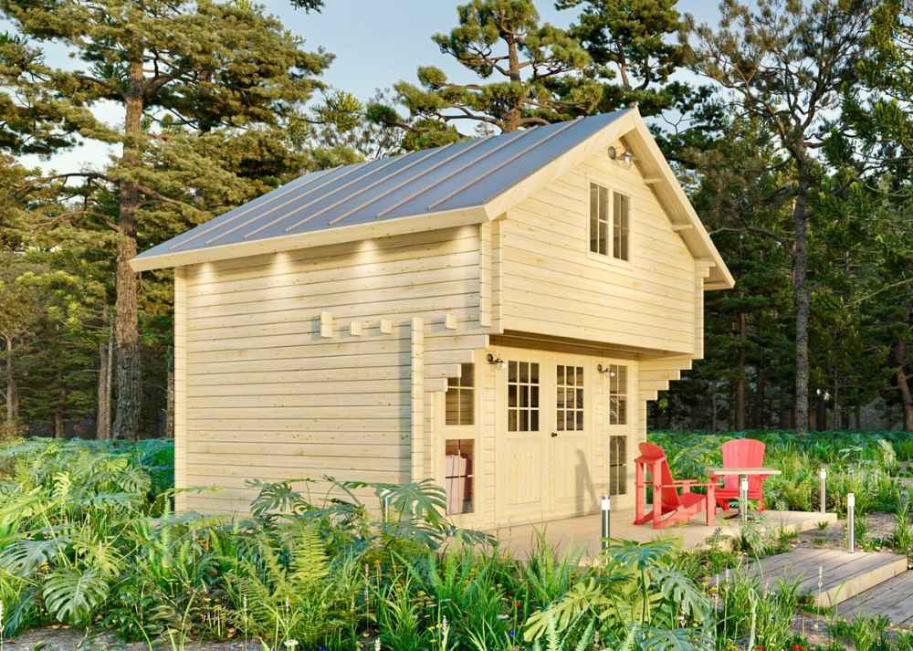 Sawmill Structures Grand Loft 107 Deluxe DD Garden Room sits in a lush forest clearing, featuring a steep metal roof, upper loft window, and double glass doors