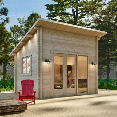 Sawmill Structures The Versa 107 70MM Garden Room sits sturdily on a wide platform, lit by soft wall sconces and complemented by a single red chair