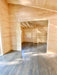 Sawmill Structures The Versa 240 70MM Garden Room appears empty and sunlit