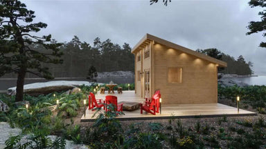 Sawmill Structures The Versa 240 70MM Garden Room is shown at dusk with glowing lights and red Adirondack chairs on a wooden deck