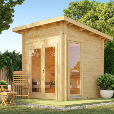 Sawmill Structures Versa Sauna is a beautifully crafted outdoor wooden cabin with large windows and a serene, spa-like atmosphere