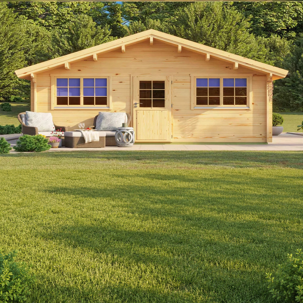 Frontal view of the GardenHouse24 USA Sean 44 Garden Room showcases its symmetrical wooden façade with two sets of double windows, a central door, and outdoor seating on a sunny lawn
