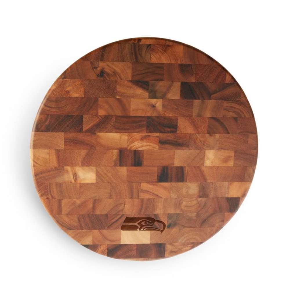 Seattle Seahawks Crate & Barrel NFL Round End Grain Cutting Board features a round wood-block design with the Seahawks head logo near the bottom