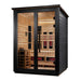 Seen from the front right, Golden Designs Loviisa 3 Person Black Barn Hybrid Outdoor Sauna shows its black exterior, glass doors and guarded stove inside