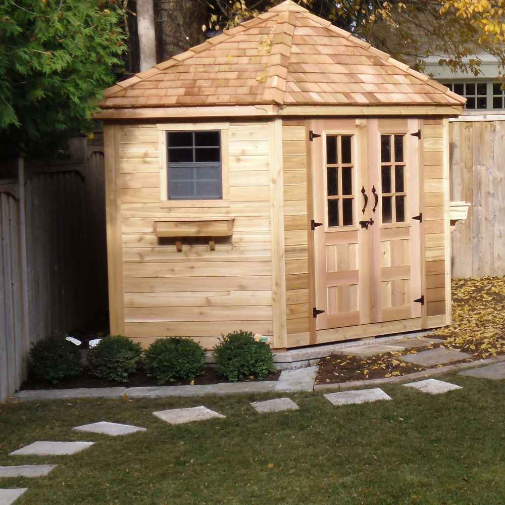 Seen from an angle, the Outdoor Living Today 9×9 Penthouse Garden Shed displays its classic side window and charming cedar finish