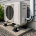 Senville Rubber Pads for Mounting Mini Split AC Condenser installed beneath an outdoor mini split unit to reduce vibration and provide stable support