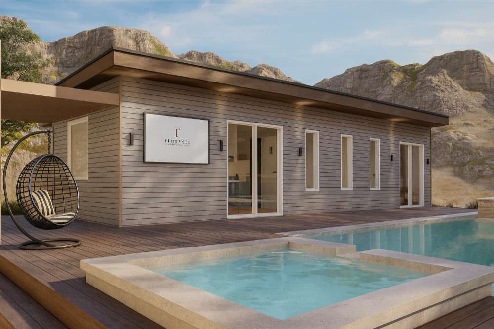 Set against a mountain backdrop, Sawmill Structures The Banff Garden Suites showcases a sleek wood-clad exterior and a relaxing spa-style pool