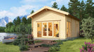 Set beside a scenic lake, the GardenHouse24 USA Sigrid 70 Garden Room looks like a tranquil retreat surrounded by mountains and pine trees