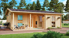 Set in a lush forested area, the GardenHouse24 USA Lilja 90 Garden Room glows warmly with large glass doors, potted plants, and soft lighting