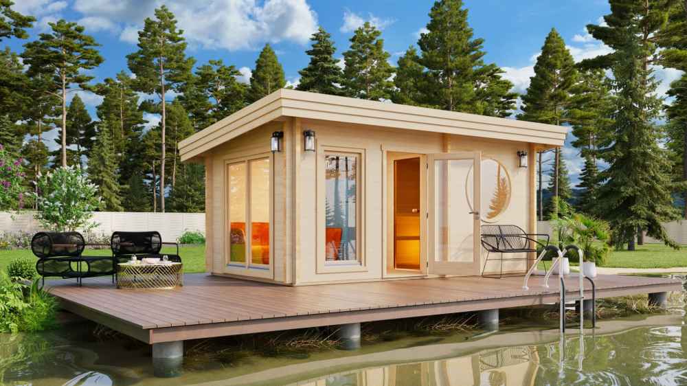 Set in a lush garden, the GardenHouse24 USA Sauna Sahib 70 Garden Room features large windows, warm lighting, and a round wooden wall detail, creating a peaceful retreat