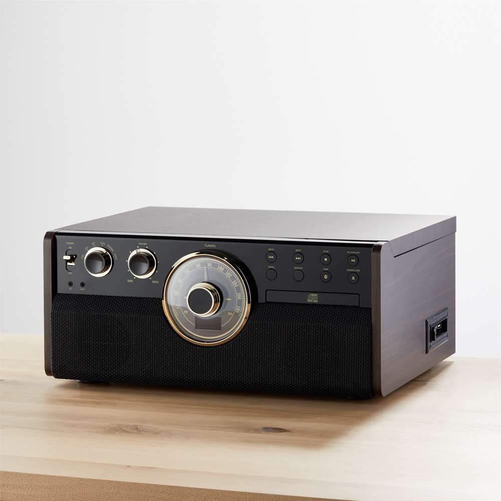 Shown closed on a wooden table, the Victrola Empire Bluetooth Record Player has a dark wood cabinet
