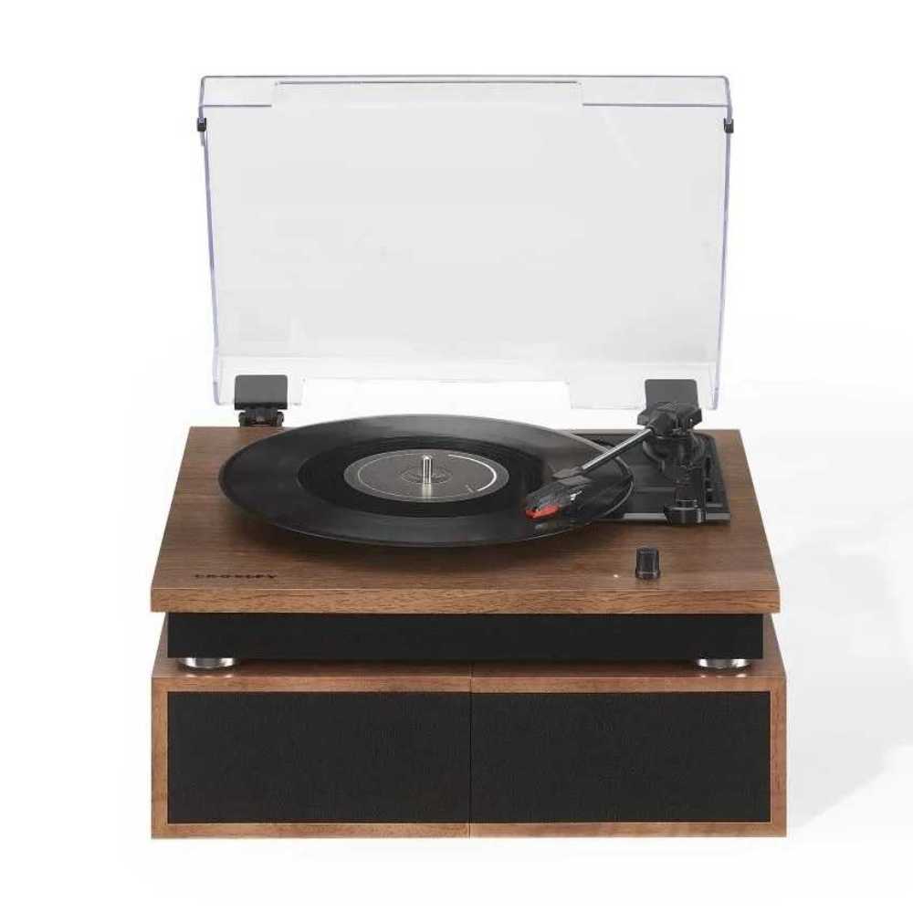 Shown playing a vinyl record, the Crosley Riff Record Player With Speakers - Walnut features an open turntable with the speakers stacked below