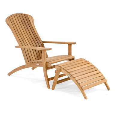 Side-angled view of Westminster Teak Adirondack Lounger and Ottoman highlighting the tall slatted back, wide armrests, and curved teak ottoman