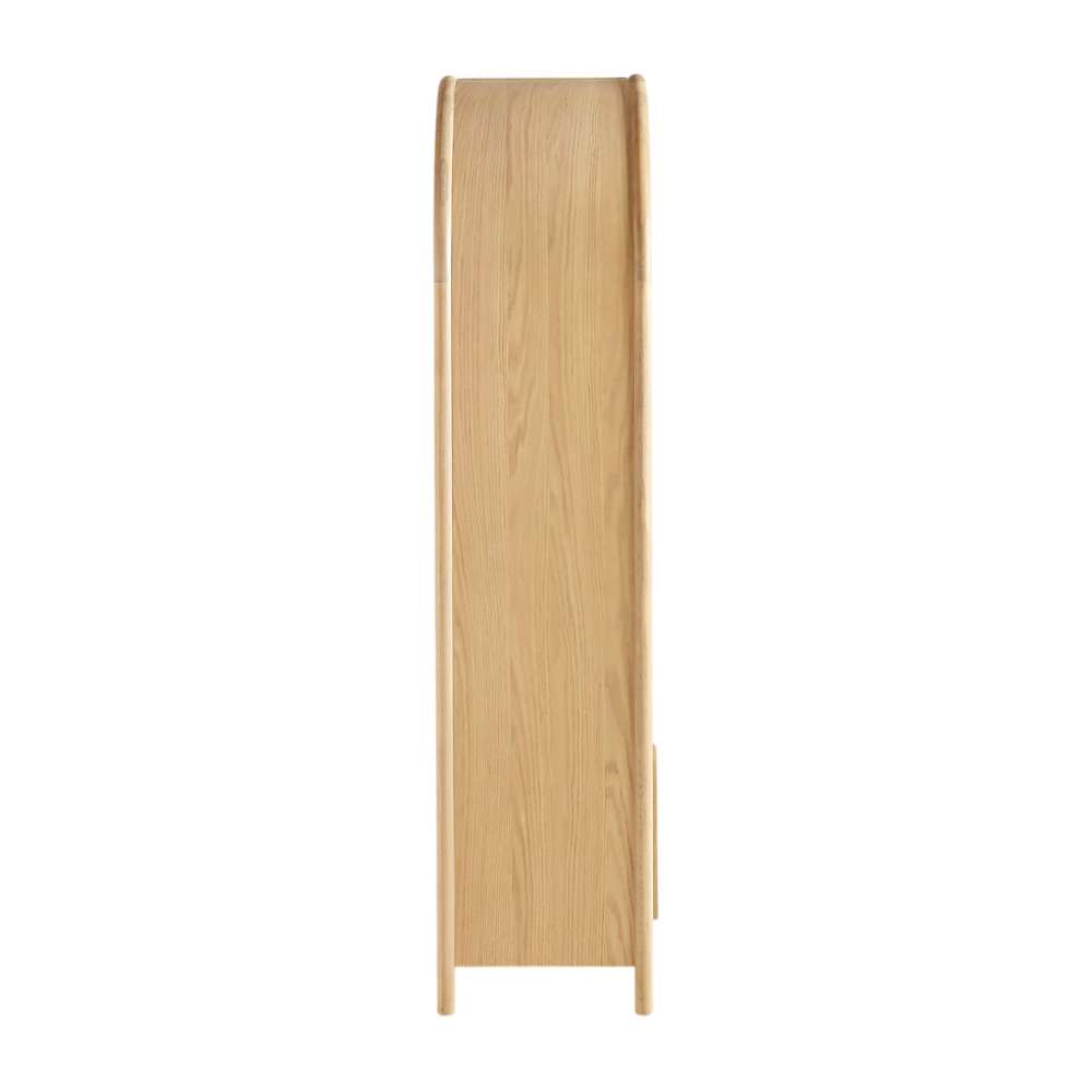 Side profile of Crate & Barrel Annie 38" Natural Wood Storage Bookcase with Shelves highlighting its slim design and rounded arch