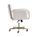 Side profile of Crate & Barrel Caterina Natural Upholstered Office Chair with Brass Base, showing its upholstered armrests, brass frame, and adjustable swivel base