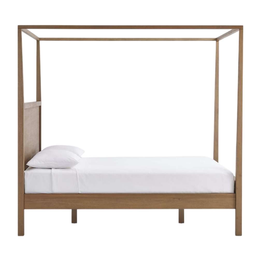 Side profile of Crate & Barrel Keane Solid Driftwood Queen Canopy Bed showing the tall canopy frame and sturdy wood construction