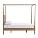 Side profile of Crate & Barrel Keane Solid Driftwood Queen Canopy Bed showing the tall canopy frame and sturdy wood construction