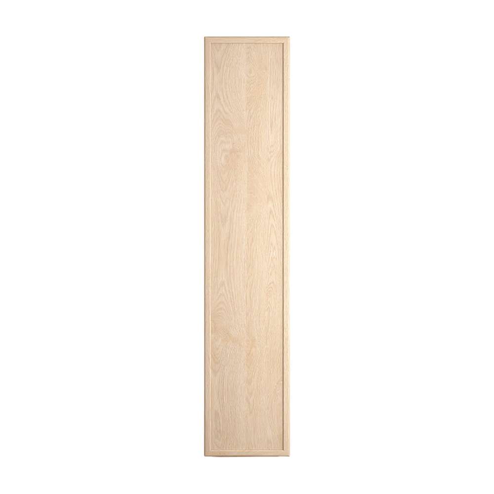 Side profile of Crate & Barrel Siena 34" Whitewash Wood 4-Shelf Storage Bookcase with Drawer showcasing its tall narrow design