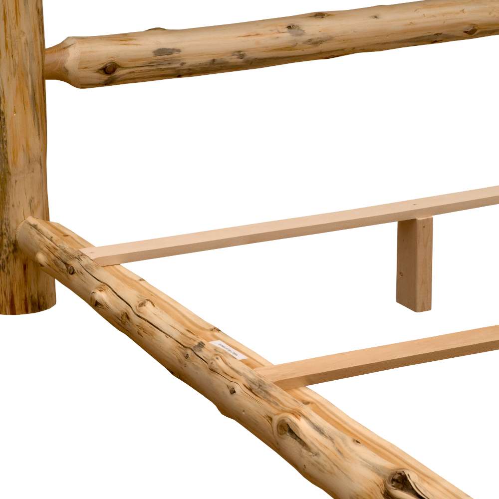 Side rail and support slats of Fireside Lodge Cedar Log Traditional Bed, showing solid cedar logs joined together to form a sturdy bed frame