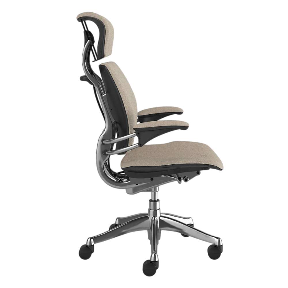 Side view of Crate & Barrel Humanscale® Freedom Headrest Natural Linen Office Chair with padded headrest, armrests, and chrome wheeled base