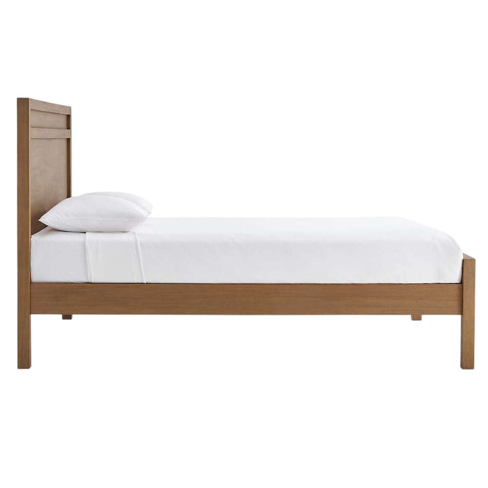 Side view of Crate & Barrel Keane Solid Driftwood King Bed showing its low-profile frame, tall headboard, and straight legs