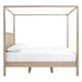Side view of Crate & Barrel Keane Weathered Natural Solid Wood King Canopy Bed shows the tall canopy frame, solid headboard, and low-profile platform base