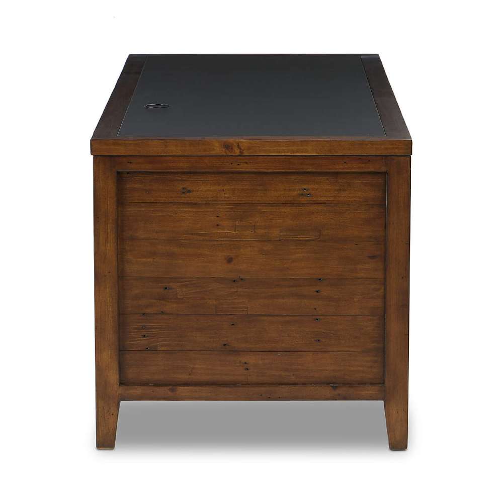 Side view of Crate & Barrel Morris 72" Chocolate Brown Writing Desk showing its paneled wood construction and black desktop insert