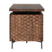 Side view of Crate & Barrel Raffael Carved Wood Executive Desk highlighting the textured carved wood panel and elevated metal frame