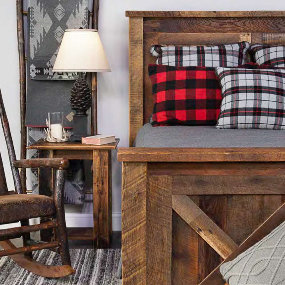 Side view of Fireside Lodge Barnwood Barndoor Bed highlighting its thick wood frame and barndoor-style panels