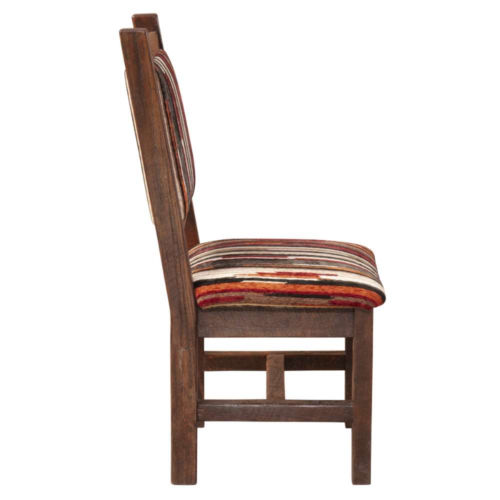 Side view of Fireside Lodge Barnwood Colonial Side Chair highlighting its solid wood frame and comfortable striped padded seat and back