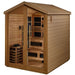 Side view of Golden Designs Kaskinen 6 Person Barn Hybrid Outdoor Sauna from the right showing horizontal wood siding, a peaked roof and the guarded stove through the glass