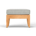 Side view of Westminster Teak Laguna Ottoman with a light gray cushion, highlighting its clean lines and sturdy wooden frame