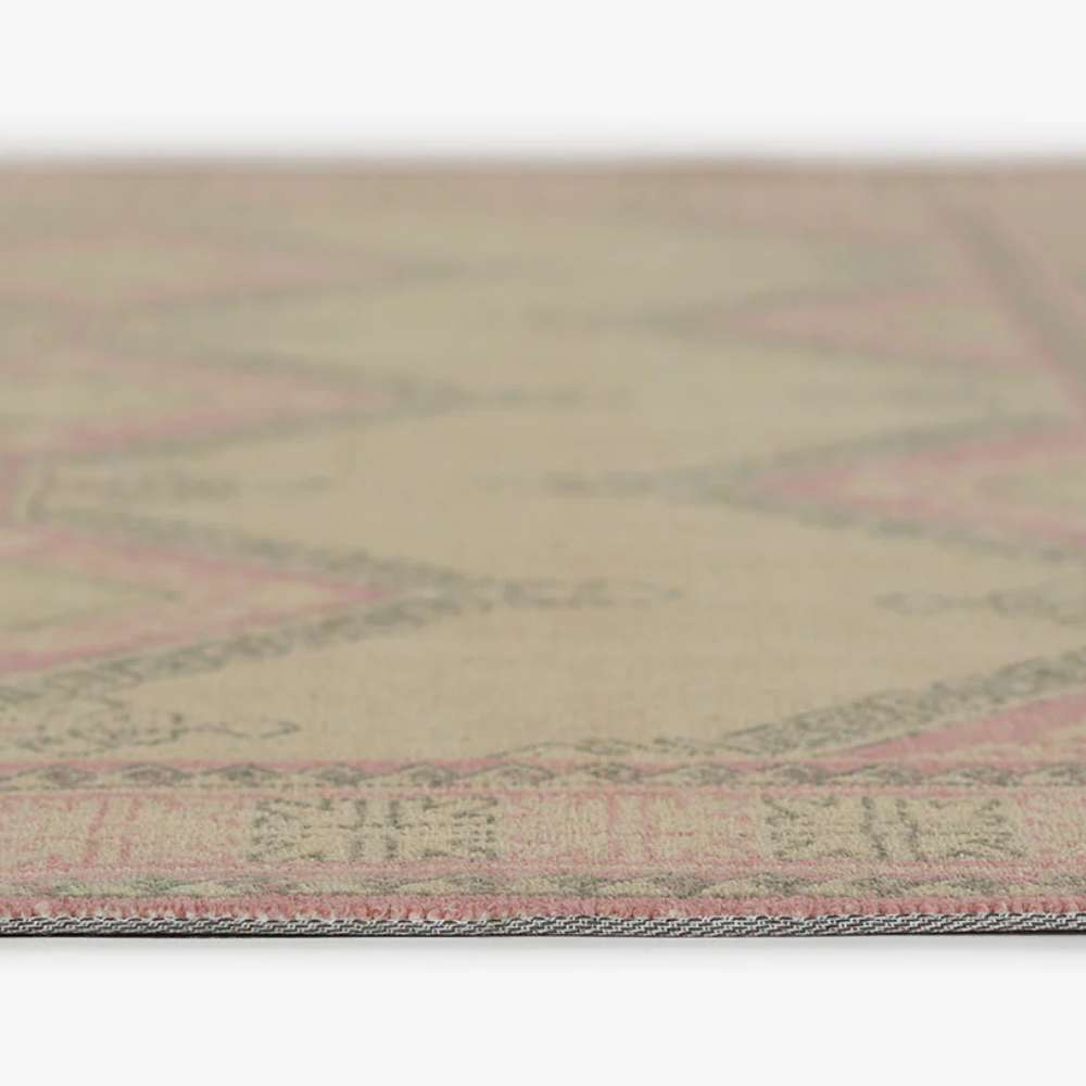 Side profile of Momeni Anatolia Indoor Rug - ANA-10 Pink emphasizing its slim, low-pile design