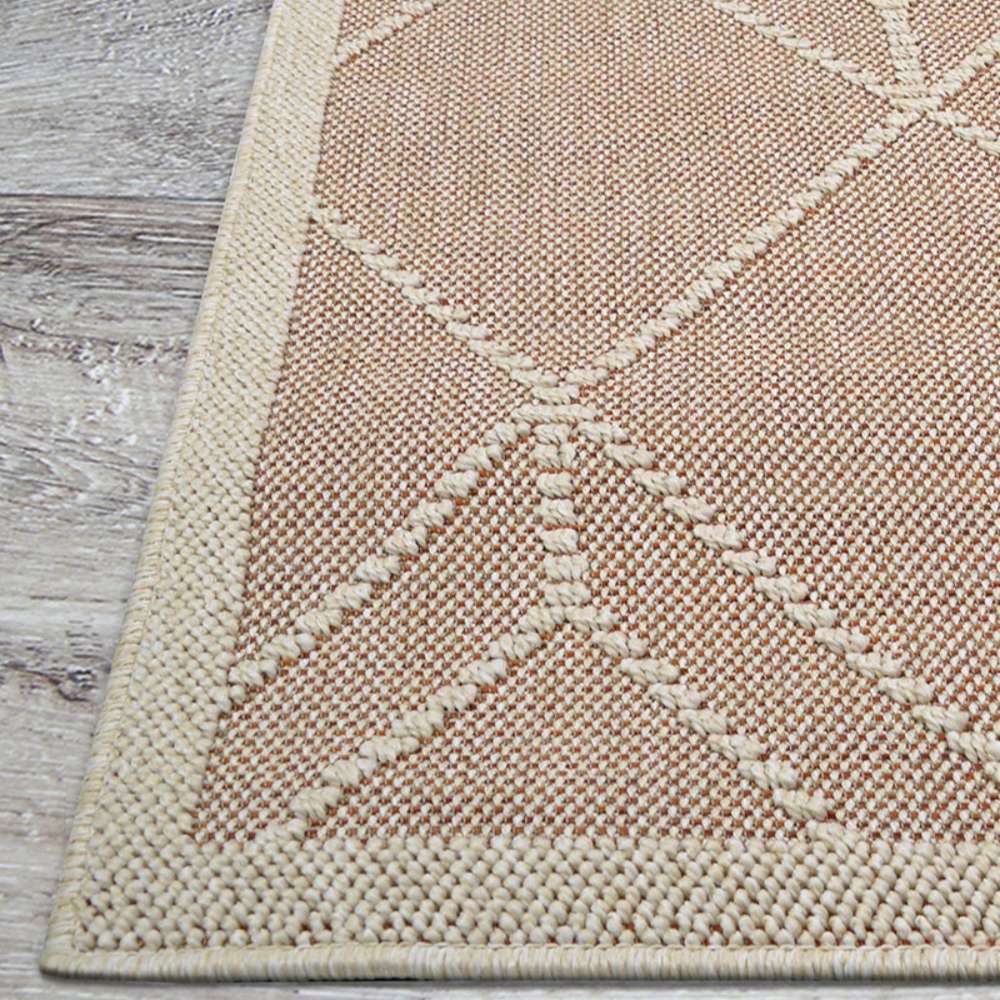 Side view of Couristan Liguria Indoor/Outdoor Rug - Noli/Umber shows the repeating diamond design with ivory stitching