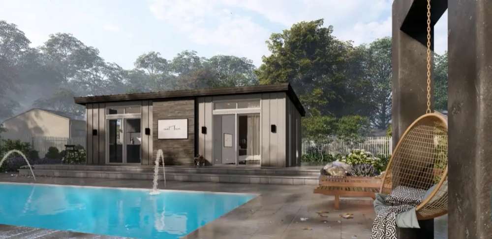 Side view of Sawmill Structures The Muskoka Garden Suites shows a peaceful poolside lounge area with a hanging chair and cozy outdoor setting