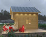 Side view of the Sawmill Structures GrandView 150 70MM Garden Room reveals its smooth wooden exterior, red Adirondack chairs, and modern pathway lighting
