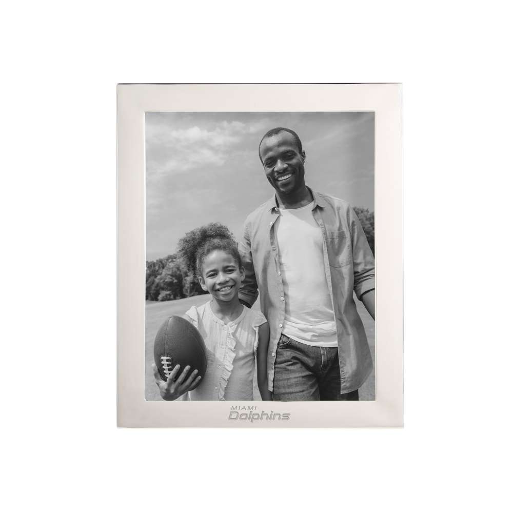 Silver Miami Dolphins Crate & Barrel NFL Signature Tabletop Picture Frame with a black-and-white photo of a girl holding a football beside a smiling man