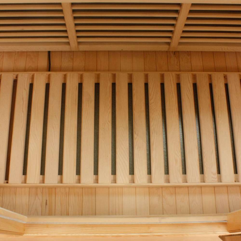 Slatted floor heater set on the cabin floor of Golden Designs Maxxus Avignon 3 Person Corner Near Zero EMF Far Infrared Sauna in Red Cedar
