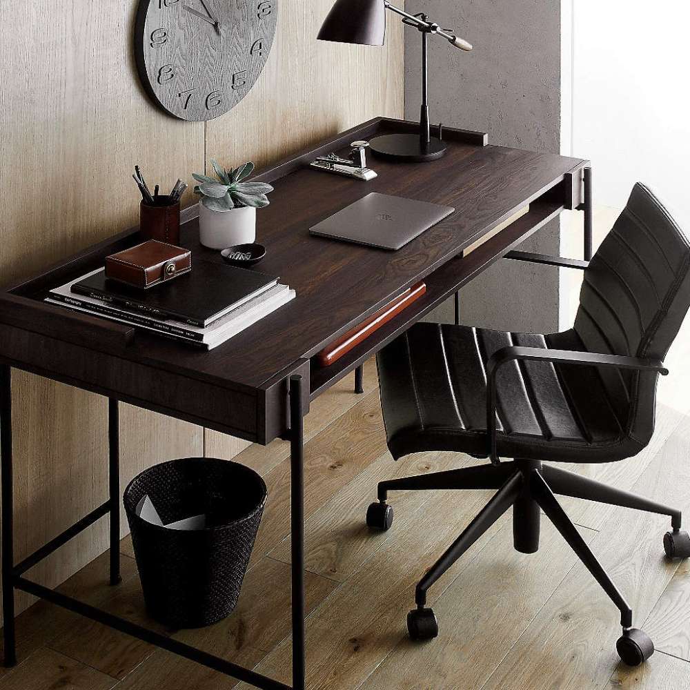 Sleek Crate & Barrel Graham Black Office Chair beside a dark wood desk in a contemporary workspace