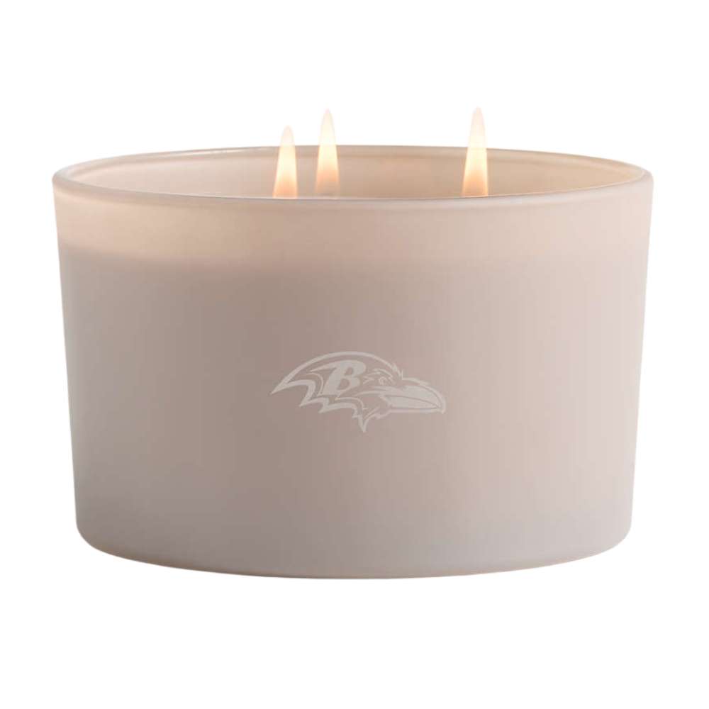 Soft amethyst three-wick Crate & Barrel Monochrome Scented Candle featuring a Baltimore Ravens logo on the front