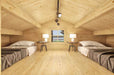 Spacious loft in the Sawmill Structures Edwin Lake House PLUS 70MM Garden Room has two single beds on either side, with a central window and soft lighting