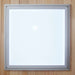 Square frosted ceiling light set in the wood roof of Golden Designs Maxxus 3 Person Low EMF Far Infrared Corner Sauna in Red Cedar