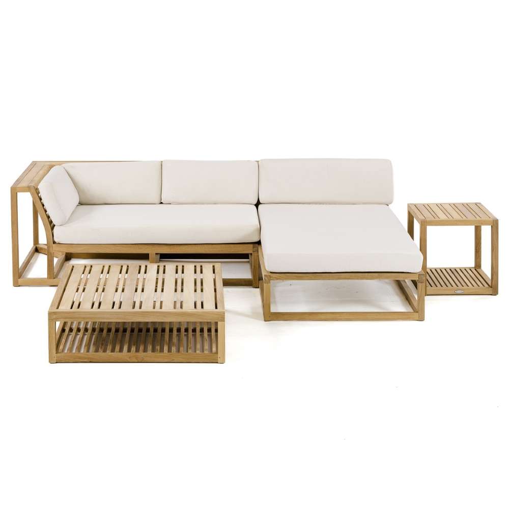 Straight-on view of Westminster Teak Maya 4pc Lounge Set featuring a clean-lined teak sofa, chaise, coffee table, and side table with light-colored cushions