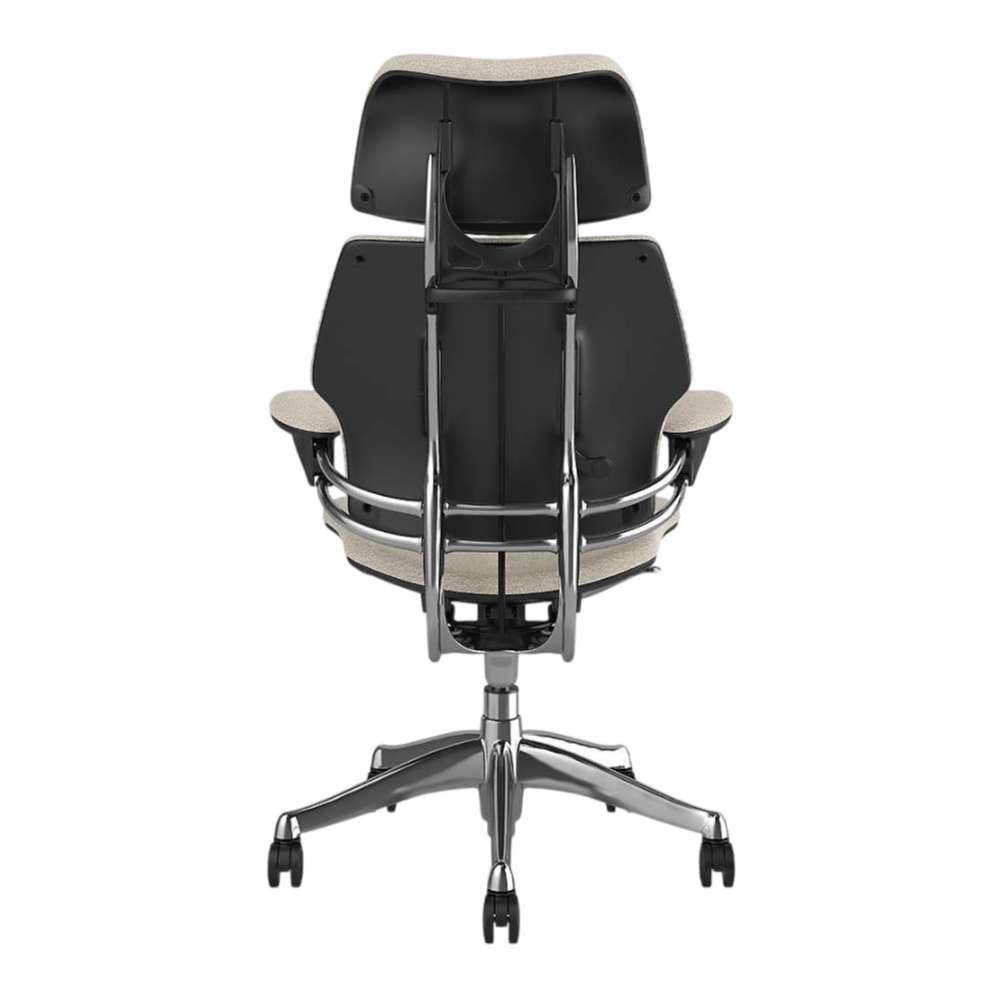 Straight rear view of Crate & Barrel Humanscale® Freedom Headrest White Boucle Office Chair showing the exposed back support frame and chrome base