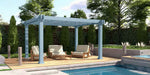 Structureworks Reverie Fiberglass Pergola provides shade for comfortable outdoor lounge seating on a poolside deck