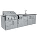 Studio shot of the Sunstone Magnolia 10ft Outdoor Kitchen Island Package showing stainless steel grill, sink, and storage units