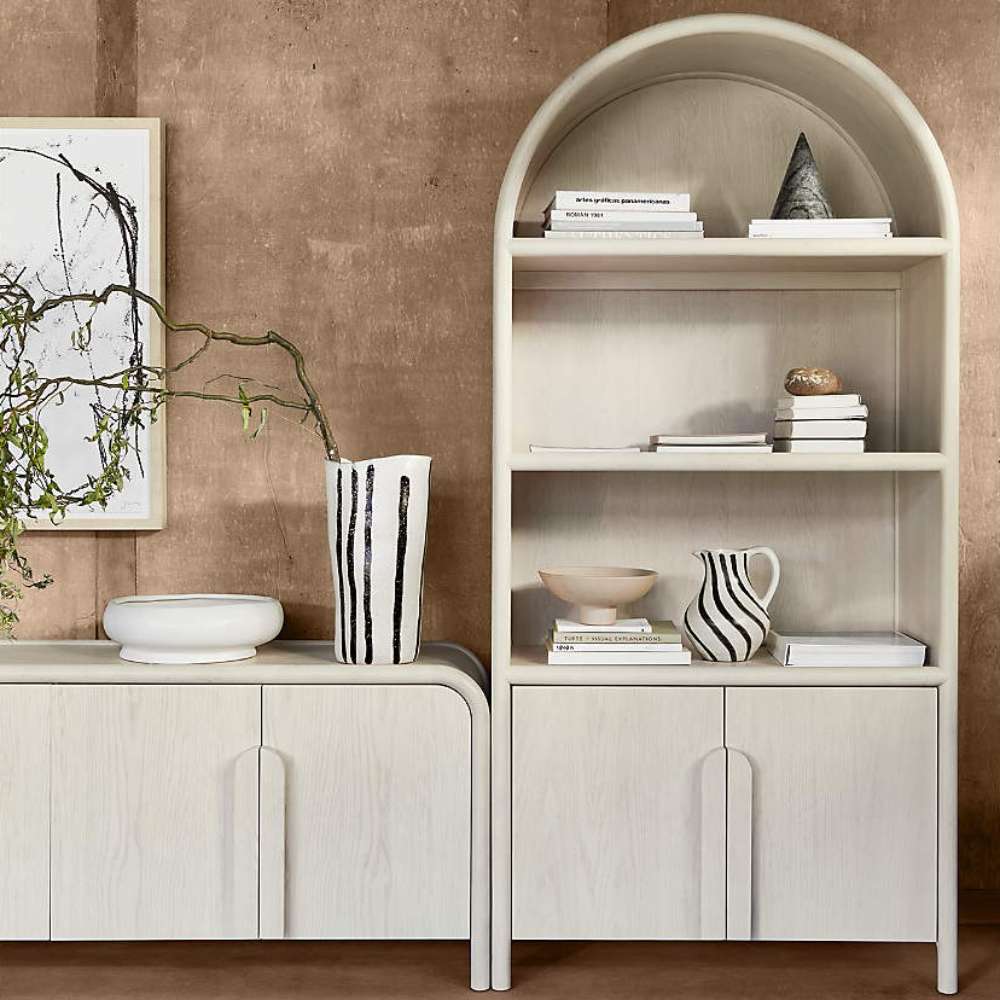 Styled Crate & Barrel Annie 38" Whitewashed Wood Storage Bookcase with Shelves displaying books, ceramics, and decorative objects